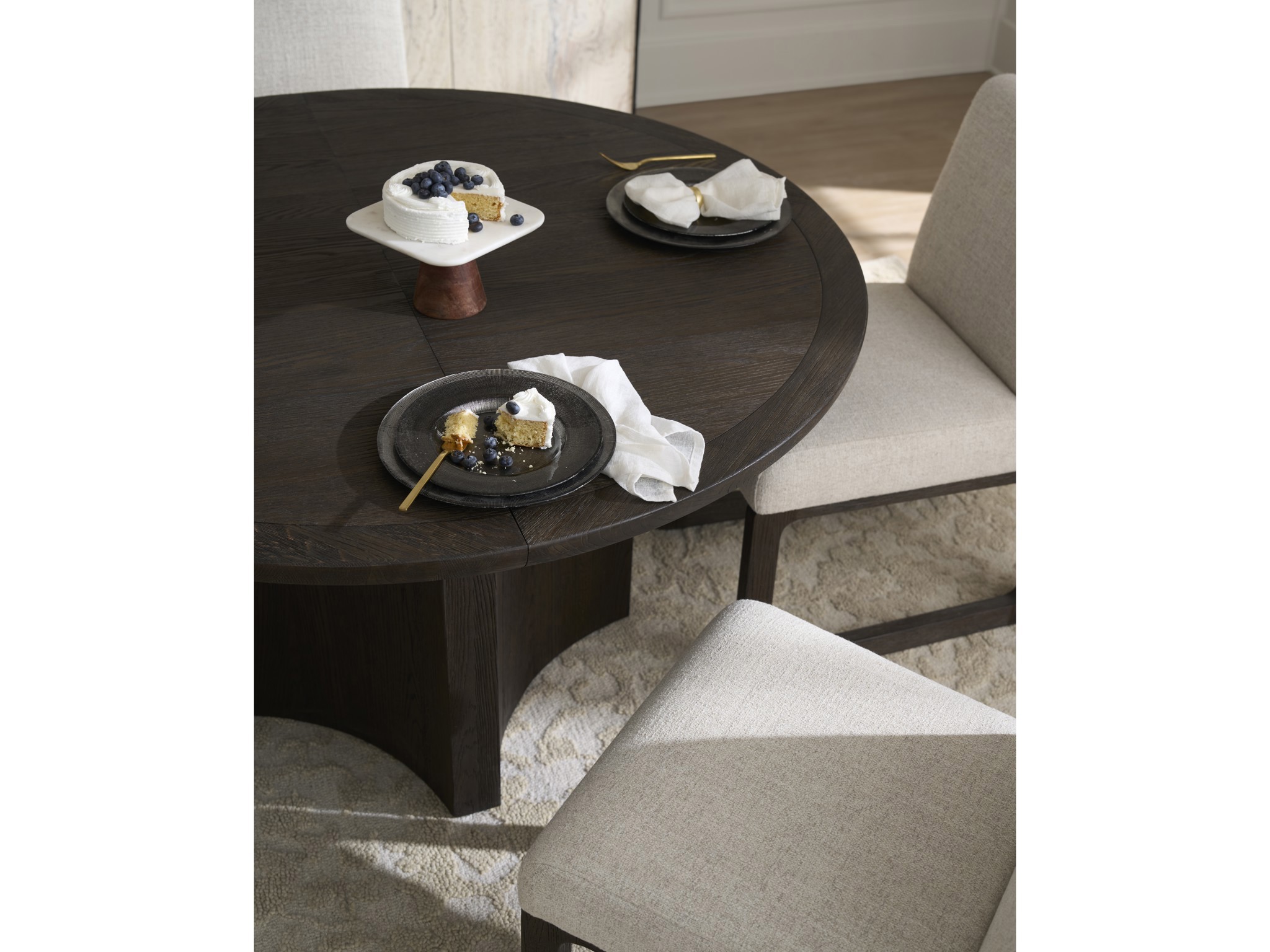Sable Round Dining Table - Multiple item room scene