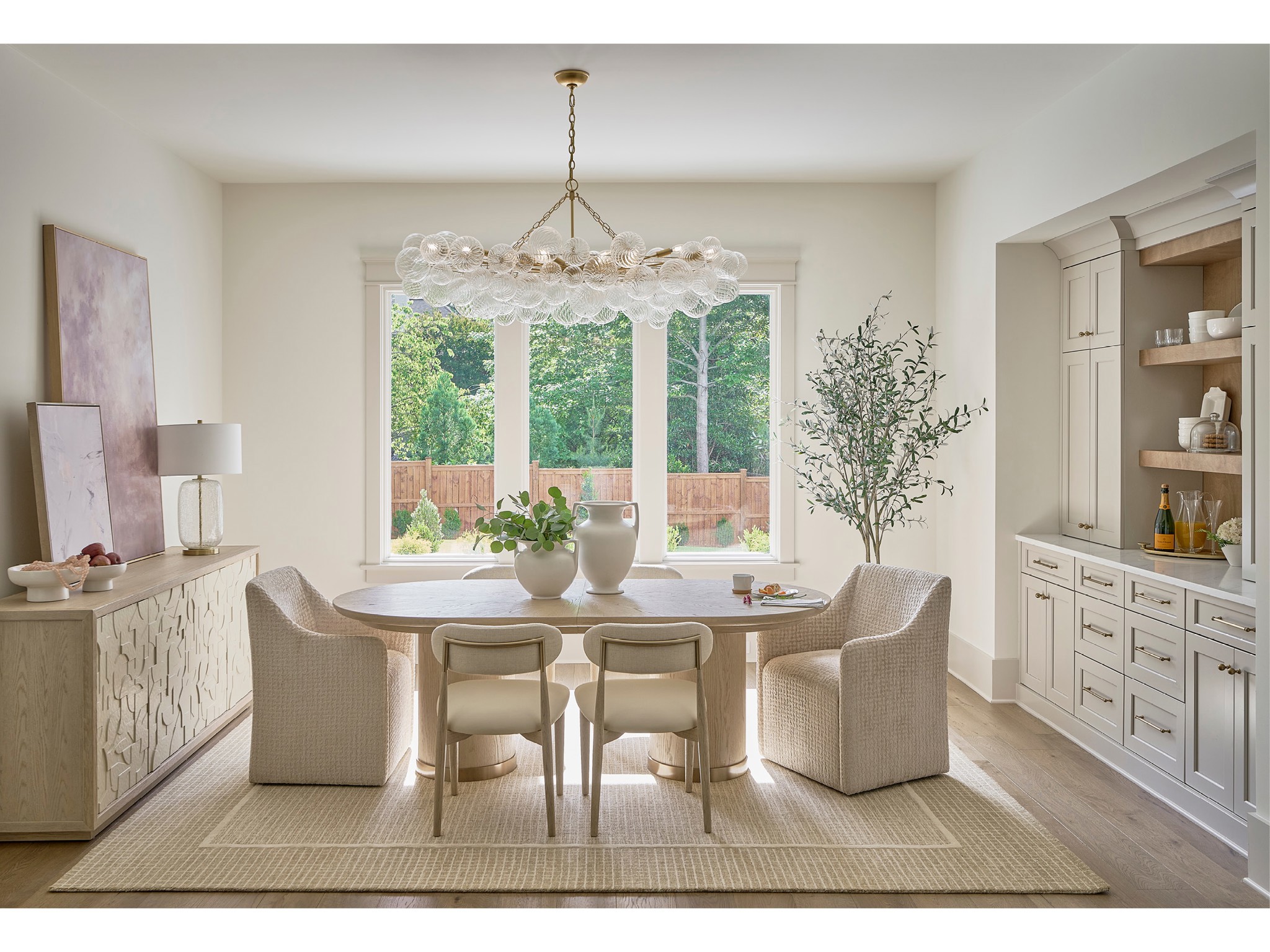 Velora Oval Dining Table - Multiple item room scene